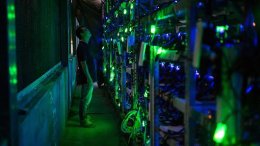 A HaoBTC bitcoin mine site manager checks mining equipment inside their bitcoin mine near Kongyuxiang, Sichuan, China.