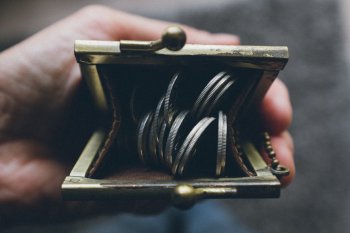 Purse filled with coins